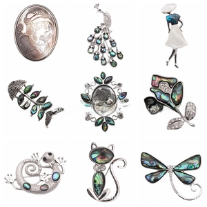 Collection of vintage silver-tone animal and shell brooches with abalone shell inlay