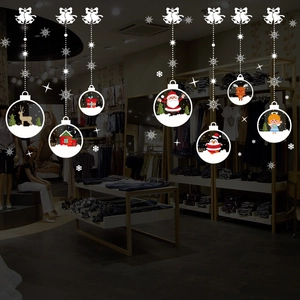 Christmas window decals with hanging ornaments featuring reindeer and Santa Claus