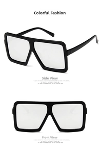 Detail view of bold black square sunglasses with silver mirror lenses from front and side