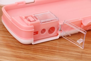 Close-up of the built-in double-hole pencil sharpener in a cute pink stationery box
