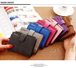 Short women's wallets in multiple candy colors featuring matte leather and buckle closure
