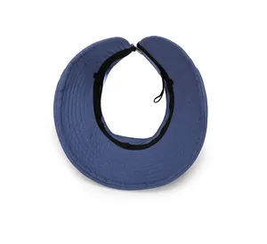 Close-up of blue sun hat interior showing black sweatband and adjustable back strap