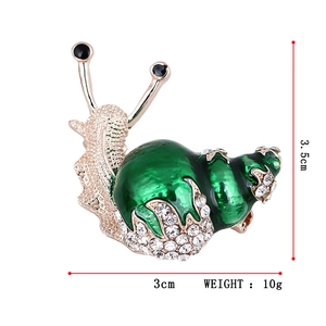 Snail brooch with green enamel and white rhinestones on gold base, 3.5cm x 3cm size