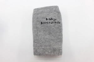 Detailed texture of grey breathable cotton baby kneepads with anti-slip print