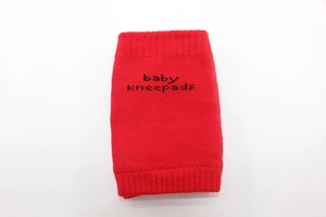 Detailed knit texture of red cotton baby kneepads with baby kneepads printed text