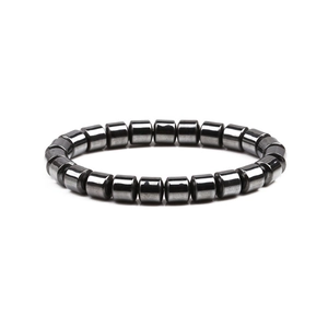 Men's 8mm black magnetic hematite beaded bracelet with cylindrical beads on white background