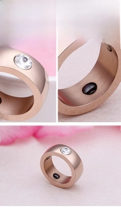 Detail view of rose gold stainless steel ring with inlaid zircon and interior magnet