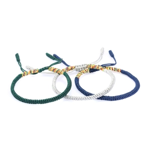 Handmade woven knot bracelets in green, blue, and silver on a clean white background