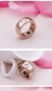Detailed macro view of rose gold magnetic therapy ring with zircon and inner magnet