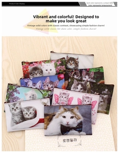 Close-up of cat print coin purses featuring assorted feline patterns and silver keychains