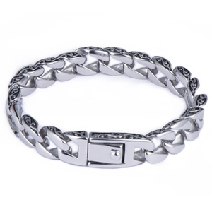Detail of silver stainless steel chain with vintage floral engraving and box clasp