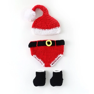 Handmade crochet baby Christmas outfit with red hat, belted shorts and black booties