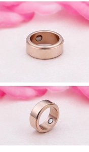 Detail view showing built-in magnetic stones inside a rose gold titanium steel ring band