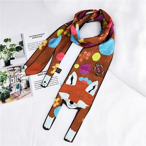 Detail of polyester silk twilly with cartoon fox and gingerbread man pattern on white fabric