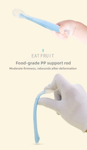 Flexible soft-tip baby training spoon with blue non-slip heart grip and PP support rod