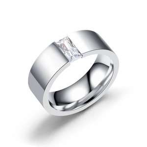 Minimalist wide silver ring with a rectangular cubic zirconia center stone on white backdrop