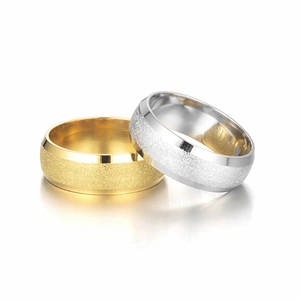 Detail of titanium steel rings with gold and silver frosted finish and polished edges