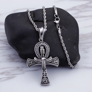 Silver stainless steel Egyptian Ankh cross pendant on twist chain over black stone
