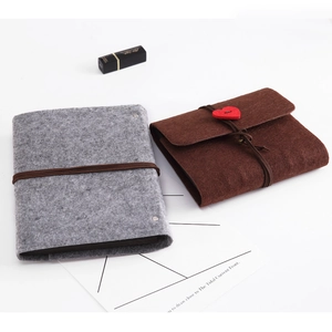 DIY felt handmade photo album set featuring grey and brown notebooks with heart button closure