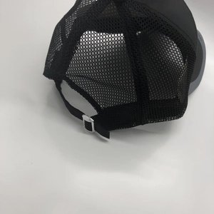 Detailed back view of a black trucker hat showing breathable mesh and adjustable metal buckle