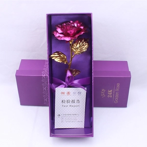 Detailed view of 24K gold foil rose in premium purple gift box with luxury ribbon