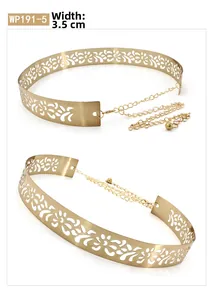 Detailed close-up of a 3.5cm wide golden hollow floral metal waist belt for dresses