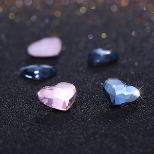 Macro detail of heart-shaped pink and blue crystals with elegant light bokeh effect