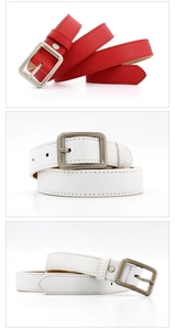 Detail showing red and white narrow leather belts with matte silver rectangular buckles