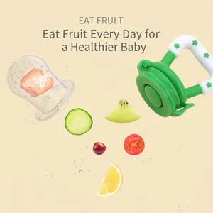 Green baby fruit feeder with silicone mesh bag and star handle on light background