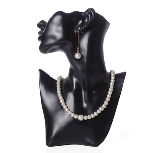 Elegant resin bust display with pearl necklace and earrings for jewelry storage