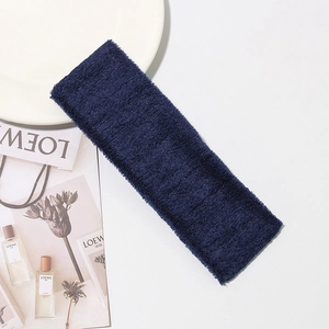 Detailed texture of thick dark blue cotton terry cloth headband for sports and yoga