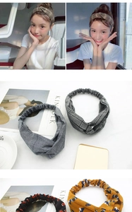 Detail of Korean style elastic twisted headbands featuring floral and plaid fabric textures
