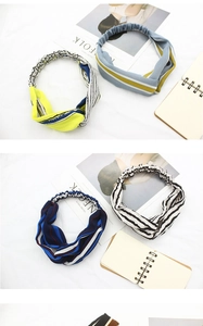Close-up of fabric twist headbands with colorful stripe patterns and elastic bands