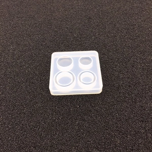 Macro detail of square silicone mold with four round cavities for DIY resin casting crafts