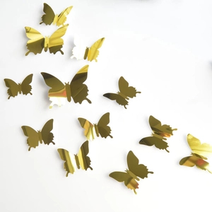 Detailed view of 3D gold mirror butterfly wall stickers with reflective metallic texture