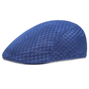 Detailed view of the breathable dark blue lace mesh texture on a summer flat cap