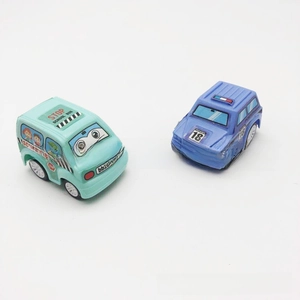 Close-up of cartoon school bus and police car toys featuring vibrant plastic colors
