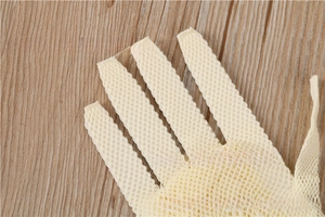 Macro shot of off-white elastic fishnet texture on five-finger bridal dance gloves
