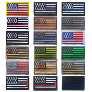 Assorted embroidered American flag tactical morale patches with hook and loop backing.