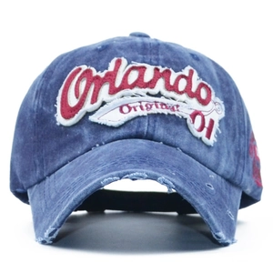 Detailed shot of dark blue washed denim baseball cap with Orlando letter embroidery