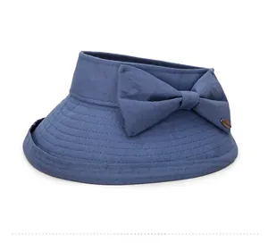 Detail view of the blue summer sun hat showing the fabric texture and decorative bow