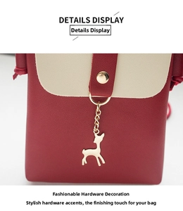 Close-up of golden deer charm and lychee texture on burgundy mobile phone bag