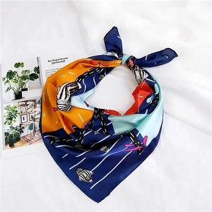 Detail of a colorful satin square scarf with abstract hot air balloon and stripe patterns