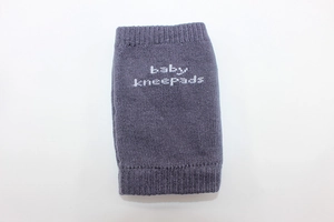 Detailed close-up of dark purple breathable cotton baby kneepads with knitted texture