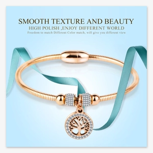 Detail of rose gold tree of life bracelet with crystal beads and magnetic clasp