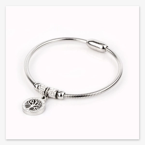 Detail of tree of life charm with rhinestones and magnetic clasp on silver snake chain