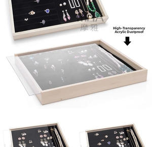 Detail view of solid wood jewelry tray with black velvet slots and clear acrylic dust lid