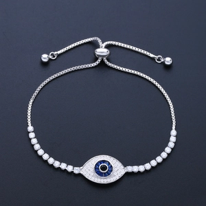 Macro shot of silver Evil Eye bracelet featuring blue crystals and white zircons detail
