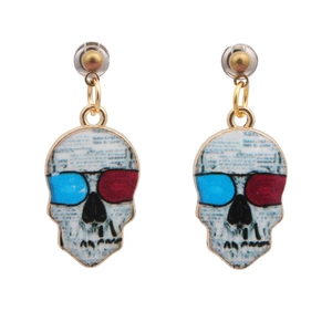 Punk style skull earrings in gold finish with red and blue eye details on white background