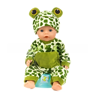 Detail of frog-themed doll outfit featuring a green spotted romper and matching hat